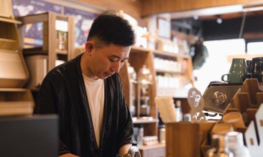 An inspector checking stock against a handheld record